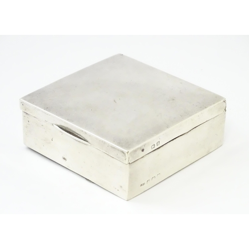 293 - A silver cigarette box hallmarked Birmingham 1921, maker I S Greenberg & Co. Approx. 3 1/4