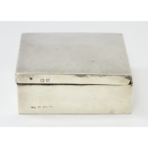 293 - A silver cigarette box hallmarked Birmingham 1921, maker I S Greenberg & Co. Approx. 3 1/4