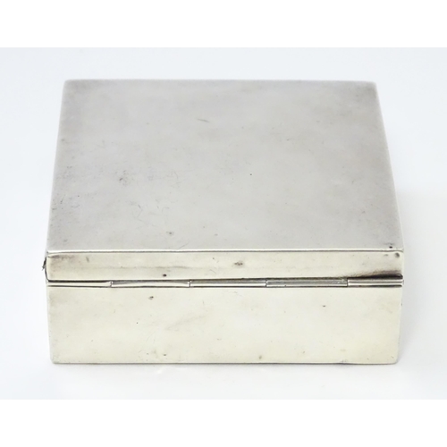 293 - A silver cigarette box hallmarked Birmingham 1921, maker I S Greenberg & Co. Approx. 3 1/4