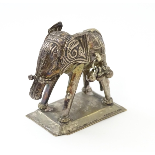 294 - A white metal model of an elephant. Approx 1 1/2