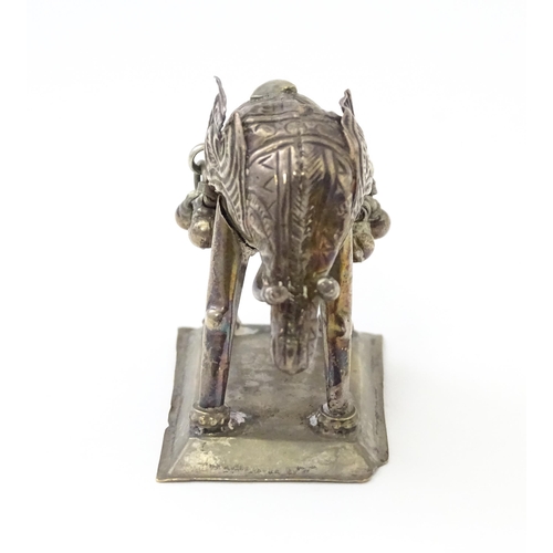 294 - A white metal model of an elephant. Approx 1 1/2