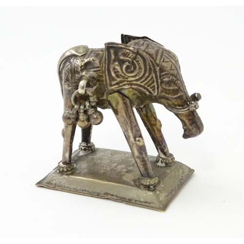 294 - A white metal model of an elephant. Approx 1 1/2