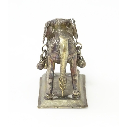 294 - A white metal model of an elephant. Approx 1 1/2