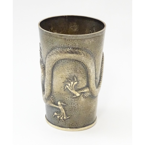 299 - A Chinese Export silver tankard decorated with an Imperial five claw dragon chasing the pearl of wis... 