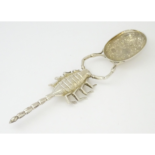 305 - A white metal spoon with Scorpion formed handle. Approx 7 3/4