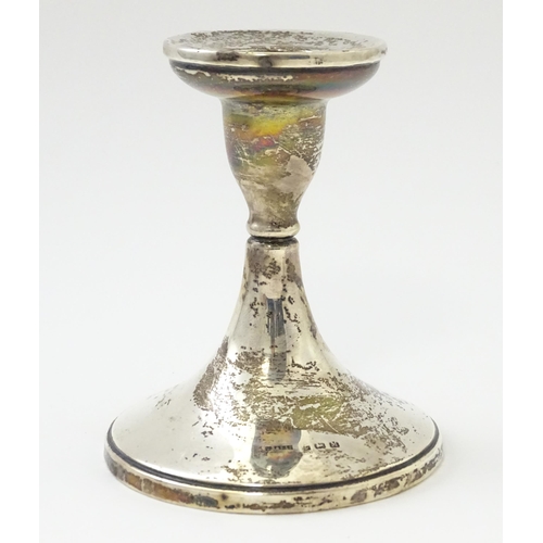 313 - A silver candlestick hallmarked Birmingham 1936 maker S Blanckensee & Son Ltd. Approx 4 1/2