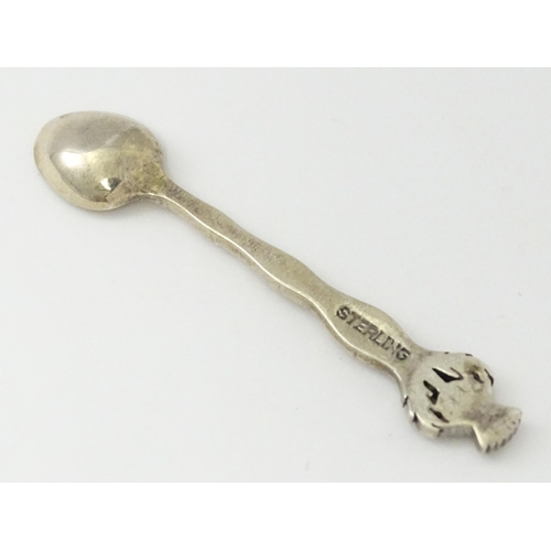 318 - A small silver spoon with Scottish silver thistle decoration to handle. Marked Sterling.   Approx. 2... 