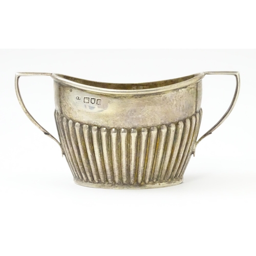 325 - A silver twin handled sugar bowl. hallmarked London 1901. Approx. 5