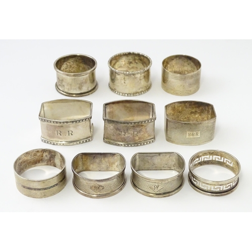 327 - Ten silver napkin rings to include a pair hallmarked Birmingham 1937 maker Adie Bros Ltd. Two hallma... 