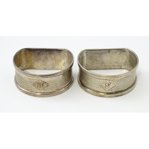 327 - Ten silver napkin rings to include a pair hallmarked Birmingham 1937 maker Adie Bros Ltd. Two hallma... 