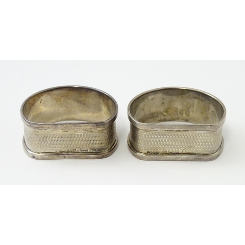 327 - Ten silver napkin rings to include a pair hallmarked Birmingham 1937 maker Adie Bros Ltd. Two hallma... 