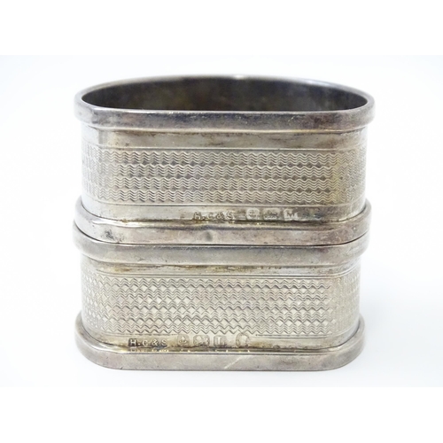 327 - Ten silver napkin rings to include a pair hallmarked Birmingham 1937 maker Adie Bros Ltd. Two hallma... 