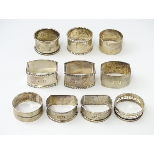 327 - Ten silver napkin rings to include a pair hallmarked Birmingham 1937 maker Adie Bros Ltd. Two hallma... 