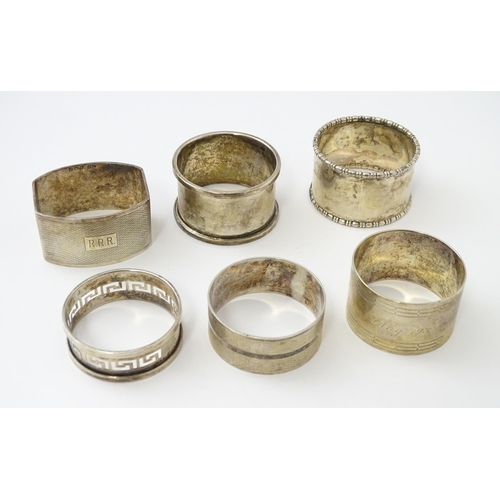 327 - Ten silver napkin rings to include a pair hallmarked Birmingham 1937 maker Adie Bros Ltd. Two hallma... 