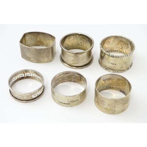 327 - Ten silver napkin rings to include a pair hallmarked Birmingham 1937 maker Adie Bros Ltd. Two hallma... 