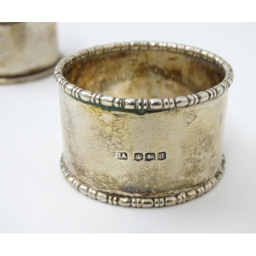 327 - Ten silver napkin rings to include a pair hallmarked Birmingham 1937 maker Adie Bros Ltd. Two hallma... 