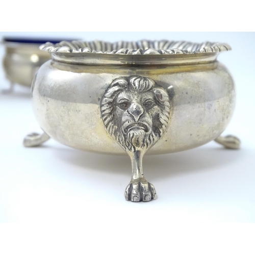 355 - Three assorted silver salts comprising one with lion mask detail raised on three lion paw feet, hall... 