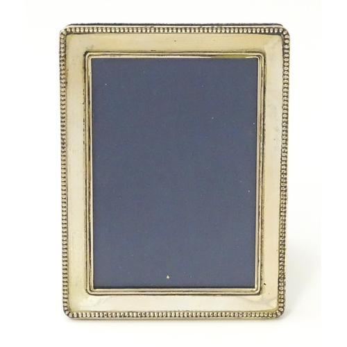 361 - An easel back photograph frame with silver surround hallmarked London 2000 maker Kitney & Co. 4