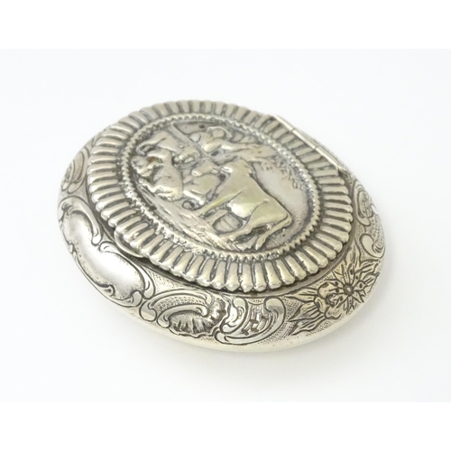 362 - A Dutch silver snuff box / tobacco box of ovoid form, the lid decorated with pastoral scene with fig... 