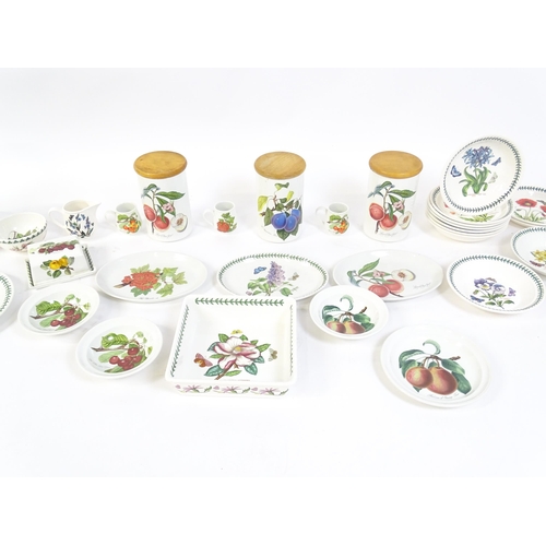 145 - A quantity of Portmeirion dinner wares to include plates, serving dishes, bowls, butter dish and cov... 