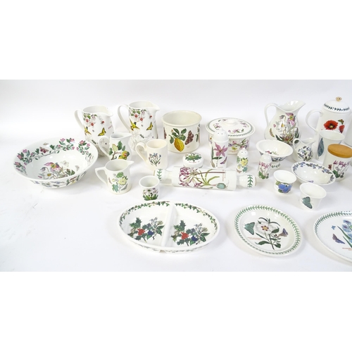 146 - A large quantity of Portmeirion wares to include serving plates, jugs, bowls, vases, cafetiere, cand... 