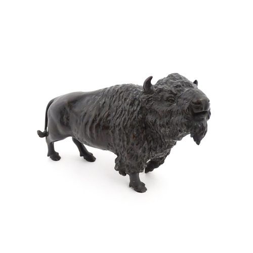 1005 - A Japanese Meiji period bronze model of a bison standing. Bears Character marks under. Together with... 