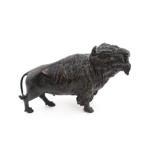 1005 - A Japanese Meiji period bronze model of a bison standing. Bears Character marks under. Together with... 