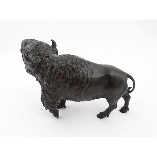 1005 - A Japanese Meiji period bronze model of a bison standing. Bears Character marks under. Together with... 