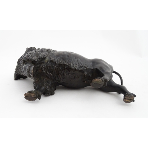 1005 - A Japanese Meiji period bronze model of a bison standing. Bears Character marks under. Together with... 