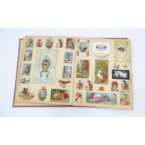 962 - A Victorian scrapbook to include various prints, engravings, greetings cards, love tokens, floral an... 