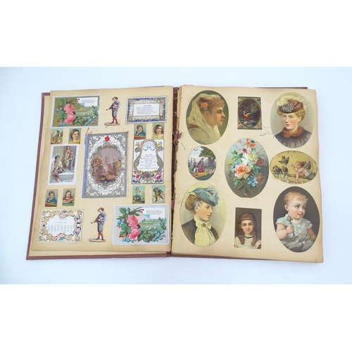 962 - A Victorian scrapbook to include various prints, engravings, greetings cards, love tokens, floral an... 