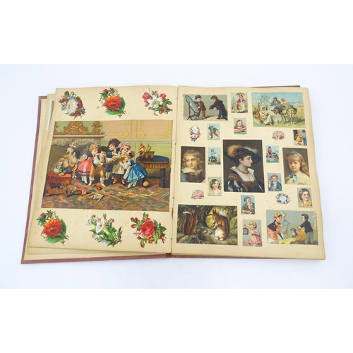 962 - A Victorian scrapbook to include various prints, engravings, greetings cards, love tokens, floral an... 