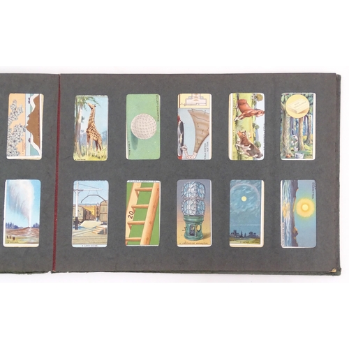 964 - A quantity of tea and cigarette cards within three albums, examples from various series including Jo... 