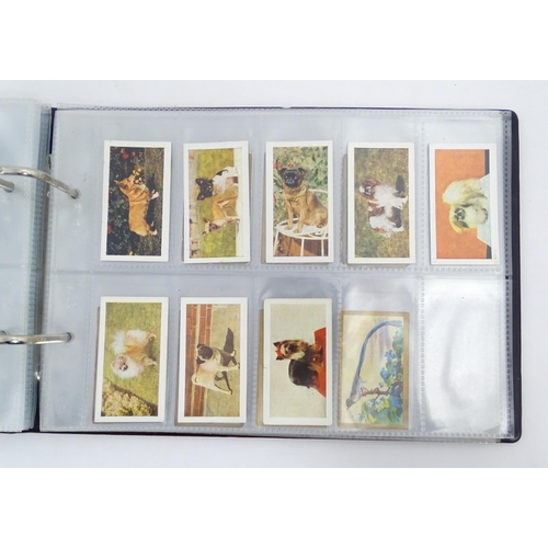 964 - A quantity of tea and cigarette cards within three albums, examples from various series including Jo... 