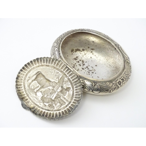 362 - A Dutch silver snuff box / tobacco box of ovoid form, the lid decorated with pastoral scene with fig... 