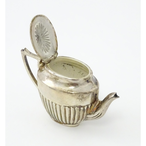 434 - A miniature / dolls house silver twin handled teapot and sugar bowl. Marked .925. Teapot approx. 1 3... 