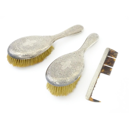 438 - Two silver backed brushes with engraved decoration hallmarked Birmingham 1893, maker Hilliard & Thom... 