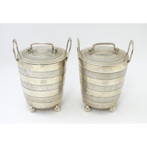 456 - A pair of unusual 19thC Indian Colonial silver tea caddies / lidded containers with twin handles and... 