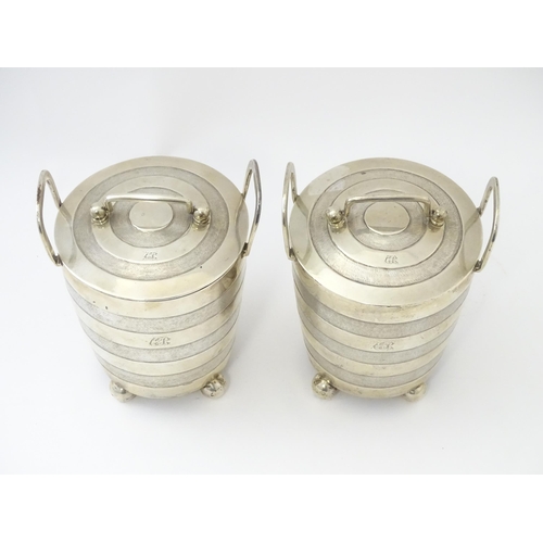 456 - A pair of unusual 19thC Indian Colonial silver tea caddies / lidded containers with twin handles and... 