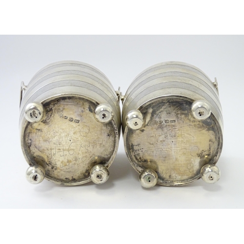 456 - A pair of unusual 19thC Indian Colonial silver tea caddies / lidded containers with twin handles and... 