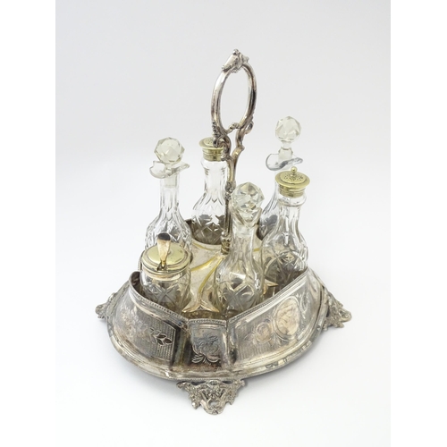 515 - A silver plate cruet stand with six various cut glass cruet bottles. Approx. 12