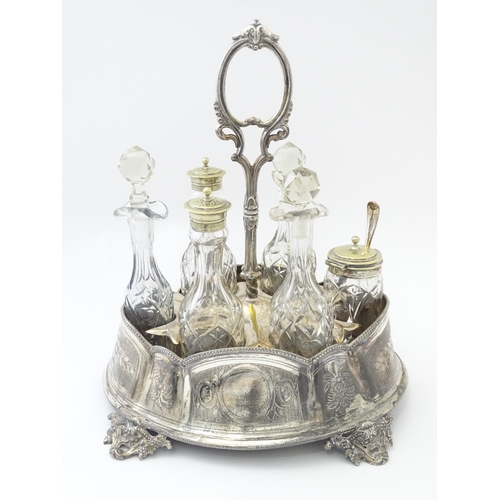 515 - A silver plate cruet stand with six various cut glass cruet bottles. Approx. 12