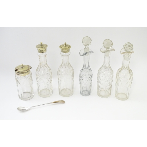 515 - A silver plate cruet stand with six various cut glass cruet bottles. Approx. 12