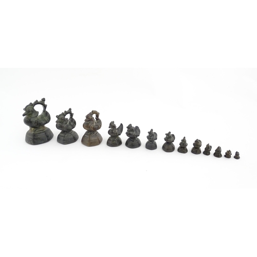 1024 - A quantity of Burmese graduated bronze opium weights modelled as crested ducks. Largest approx. 4 1/... 