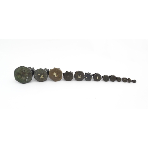 1024 - A quantity of Burmese graduated bronze opium weights modelled as crested ducks. Largest approx. 4 1/... 