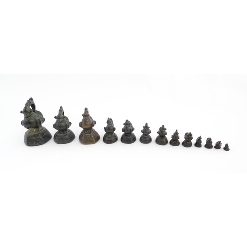 1024 - A quantity of Burmese graduated bronze opium weights modelled as crested ducks. Largest approx. 4 1/... 