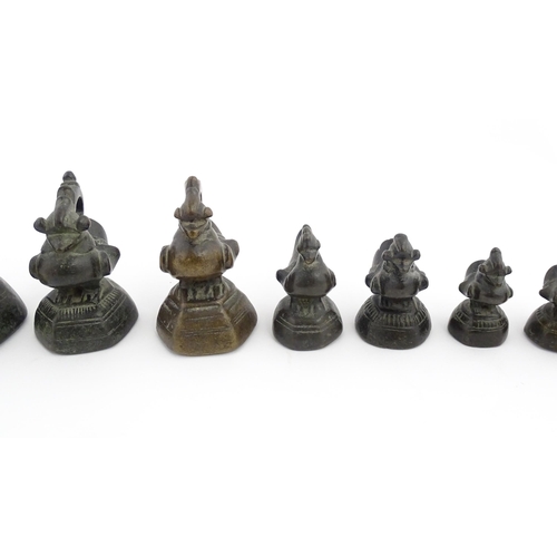 1024 - A quantity of Burmese graduated bronze opium weights modelled as crested ducks. Largest approx. 4 1/... 