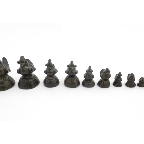 1024 - A quantity of Burmese graduated bronze opium weights modelled as crested ducks. Largest approx. 4 1/... 