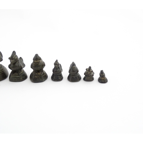 1024 - A quantity of Burmese graduated bronze opium weights modelled as crested ducks. Largest approx. 4 1/... 