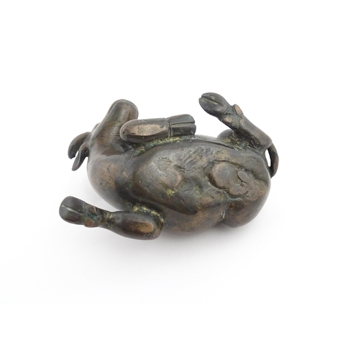 1025 - A Chinese Ming dynasty bronze censer modelled as a recumbent buffalo. Approx. 4 3/4